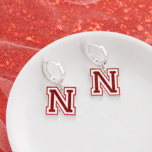 Nebraska Glitter Enamel Logo Huggie Hoop Earrings