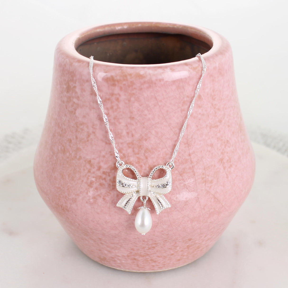 Crystal Bow w/Dangle Pearl Necklace