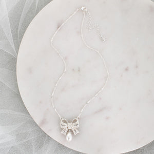 Crystal Bow w/Dangle Pearl Necklace
