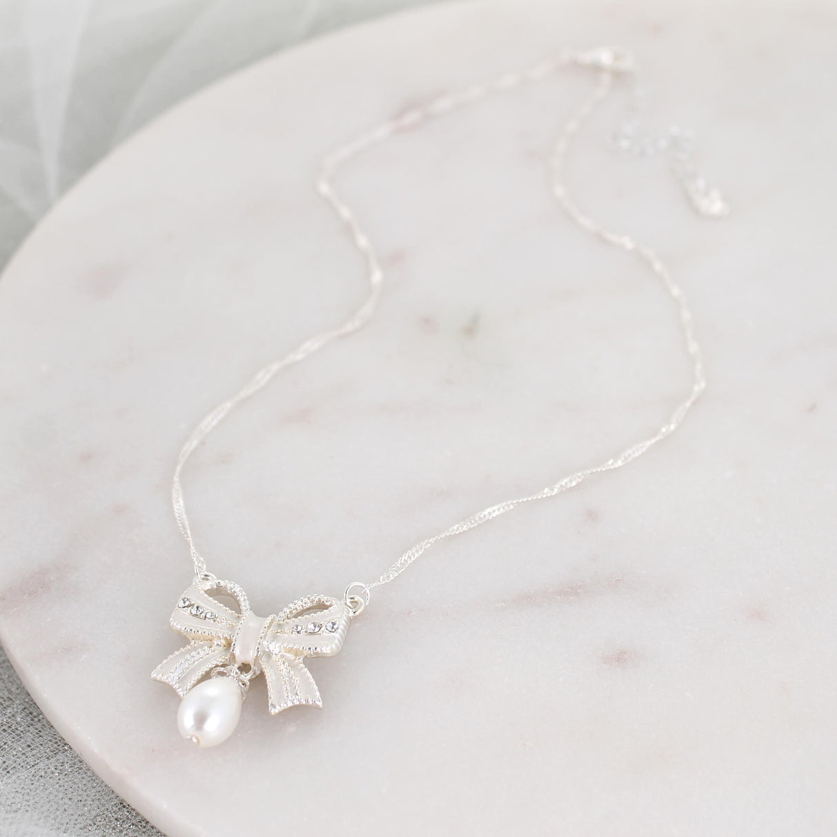 Crystal Bow w/Dangle Pearl Necklace